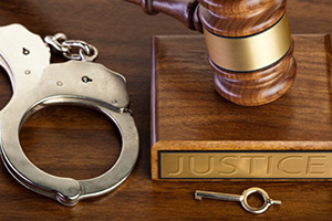 Picture of handcuffs on a judge's desk